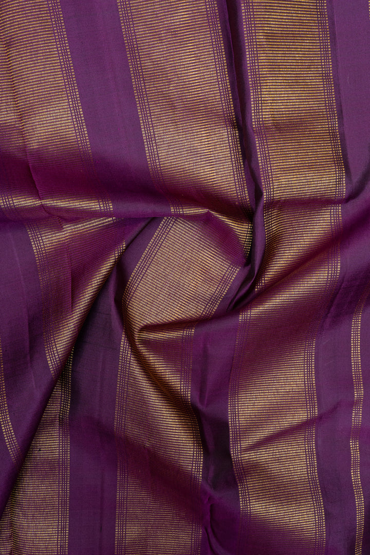 Emerald green and purple pure kanchipuram silk saree