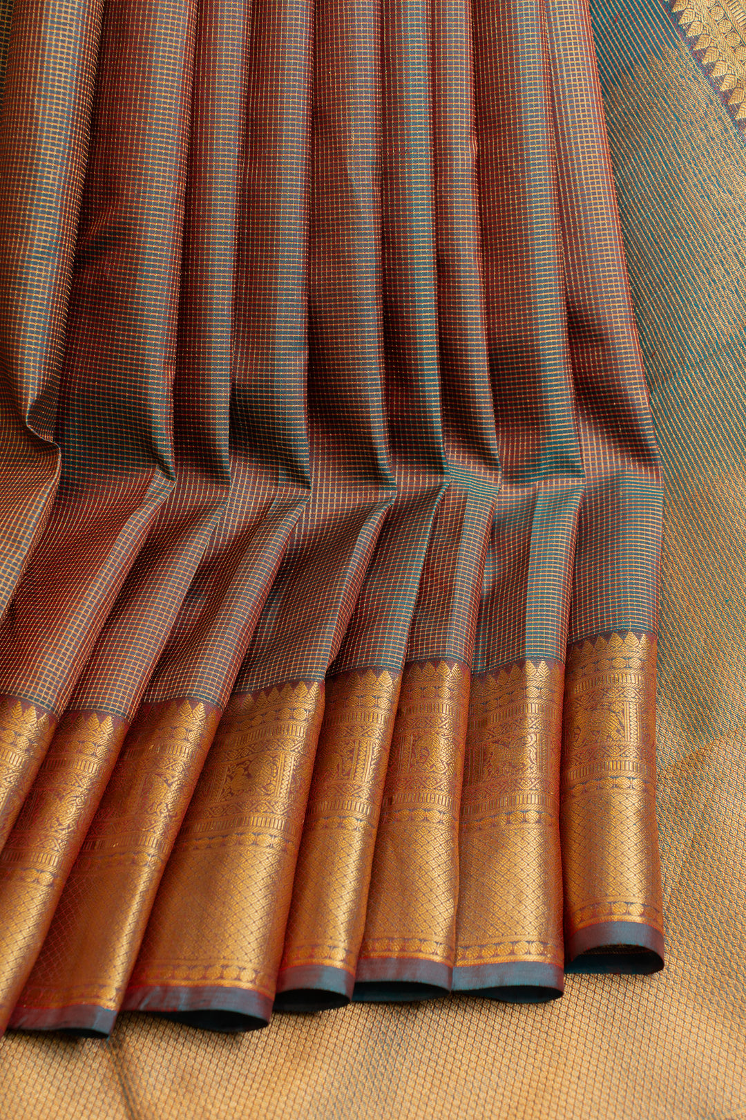 Mandhulir green zari checks pure Kanchipuram silk saree