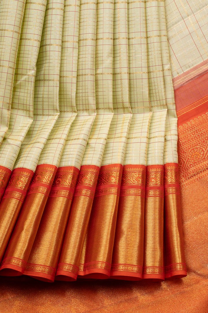 Pastel green and orange Zari checks pure kanchipuram silk saree