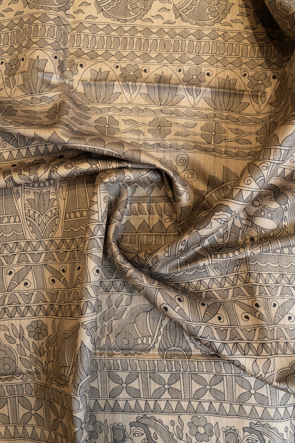 Beige and black Madhubani hand printed pure Tussar saree