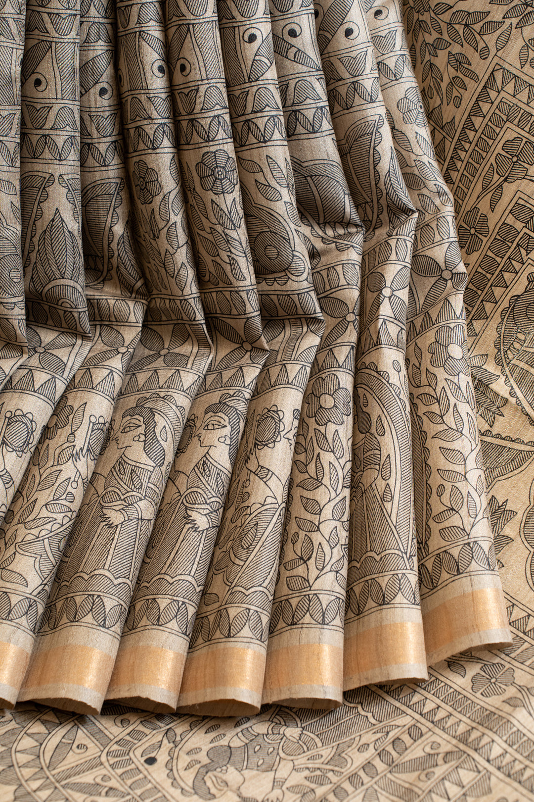 Beige and black Madhubani hand printed pure Tussar saree
