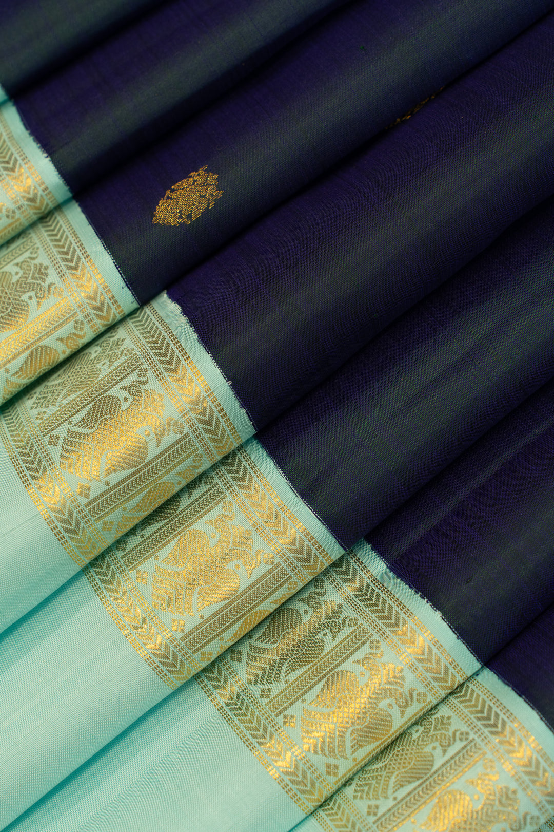 Peacock blue iruthalaipakshi rettai pettu pure zari Kanchipuram silk saree