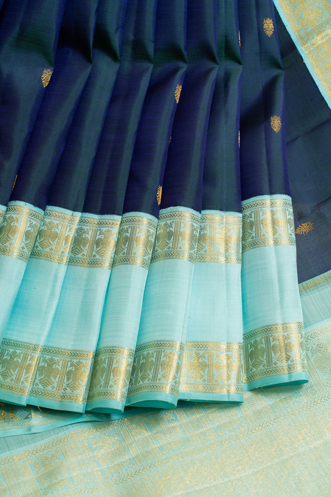 Peacock blue iruthalaipakshi rettai pettu pure zari Kanchipuram silk saree
