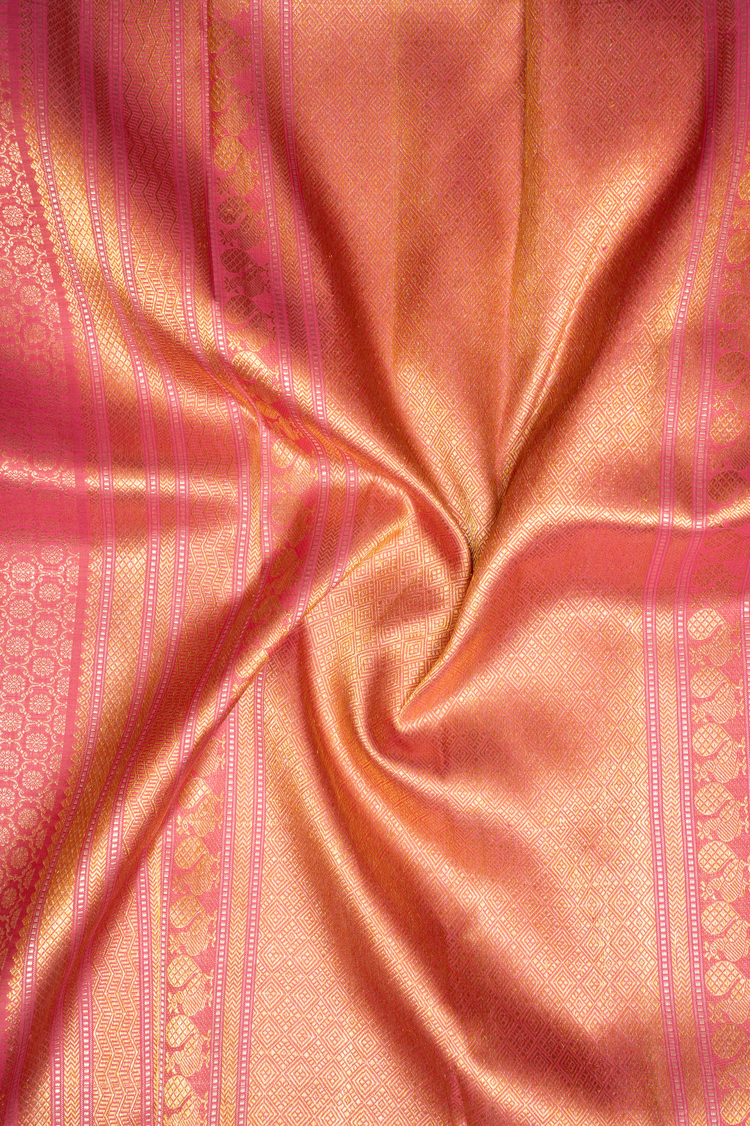 Luxurious silk adorned with intricate gold motifs, embodying timeless grace and opulence for a special occasion.