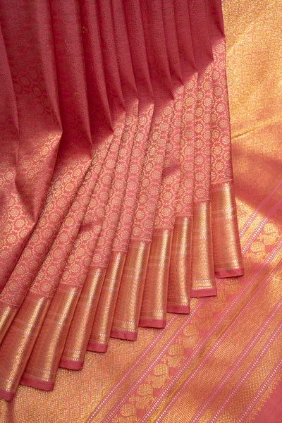  a traditional Kanchipuram silk saree adorned with intricate golden zari patterns, reflecting the rich heritage of Indian craftsmanship and culture
