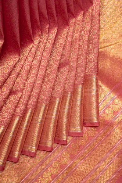 Exquisite traditional Kanchipuram silk saree, featuring intricate golden zari work on a richly woven silk fabric, showcasing timeless elegance and cultural heritage.