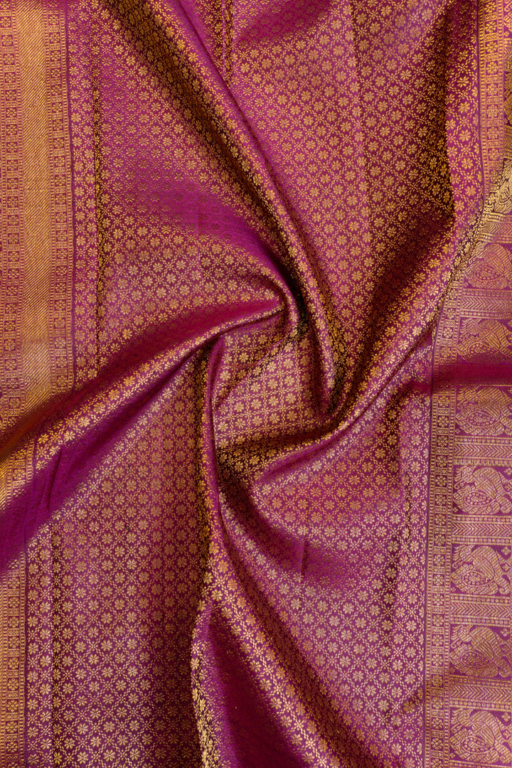 Greenish blue and magenta stripes border pure Kanchipuram silk saree