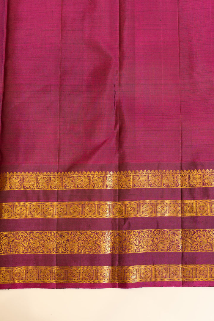 Greenish blue and magenta stripes border pure Kanchipuram silk saree