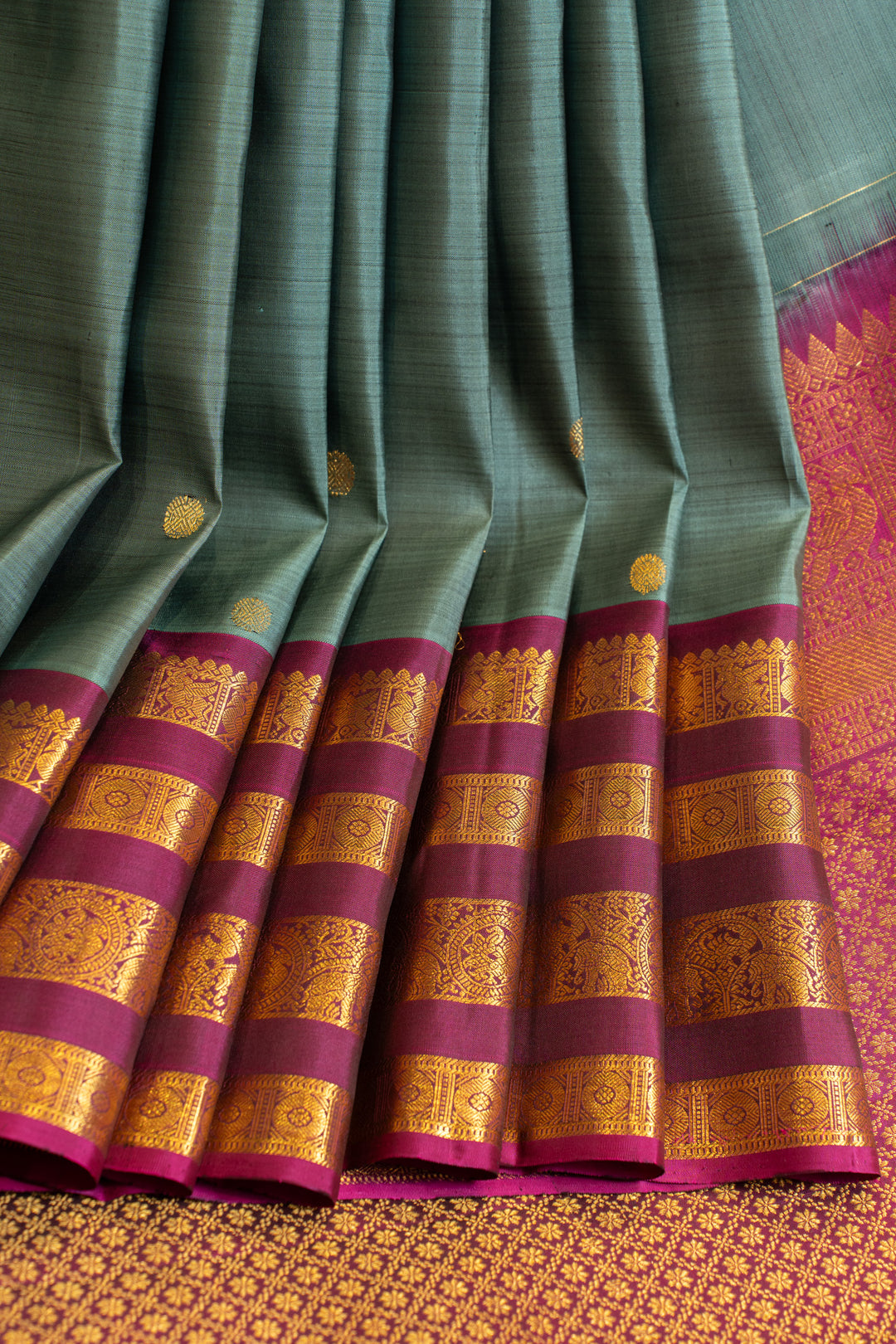Greenish blue and magenta stripes border pure Kanchipuram silk saree