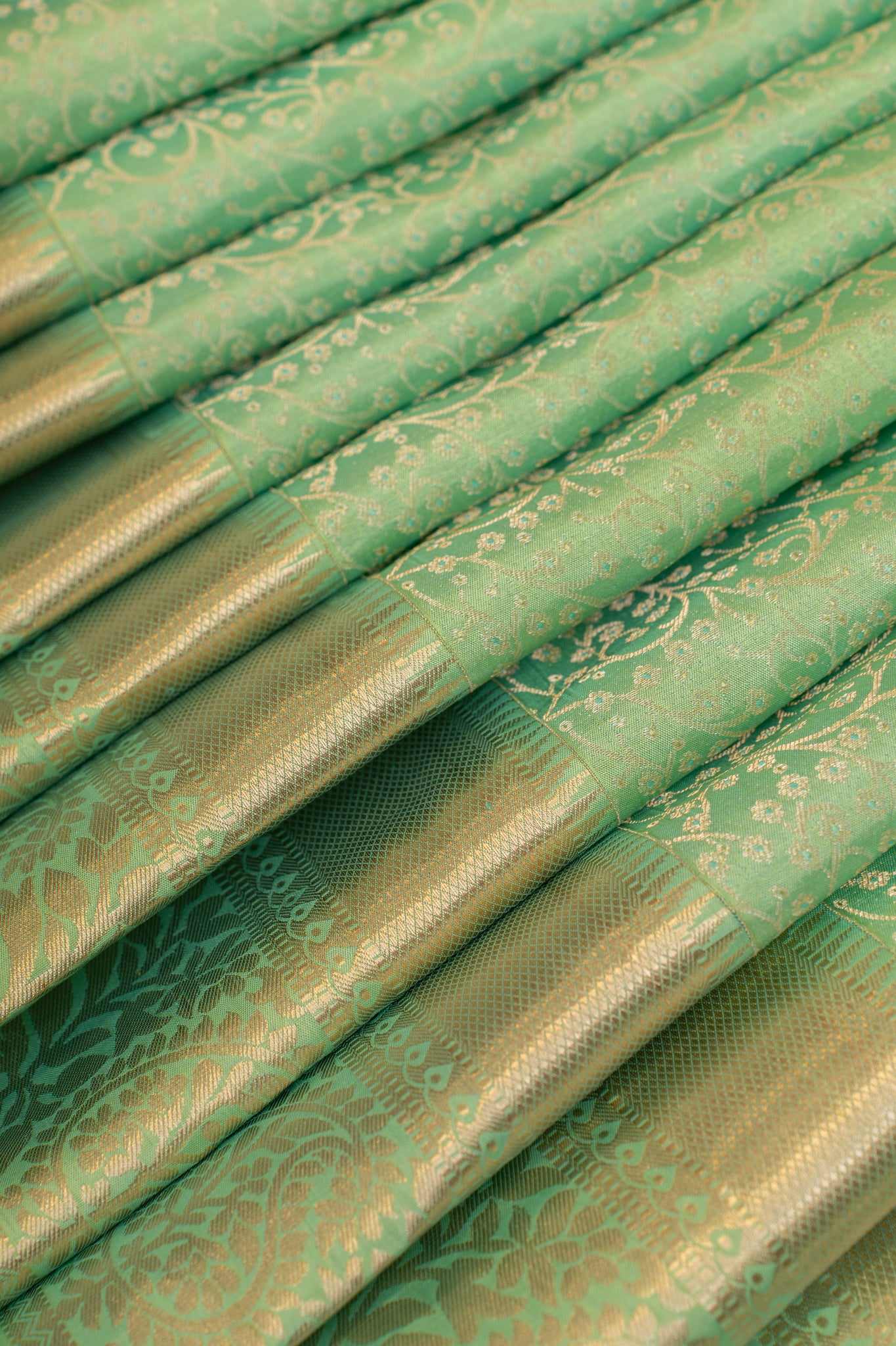 Cyan green embossed brocade pure Kanchipuram silk saree