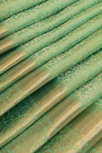 Cyan green embossed brocade pure Kanchipuram silk saree