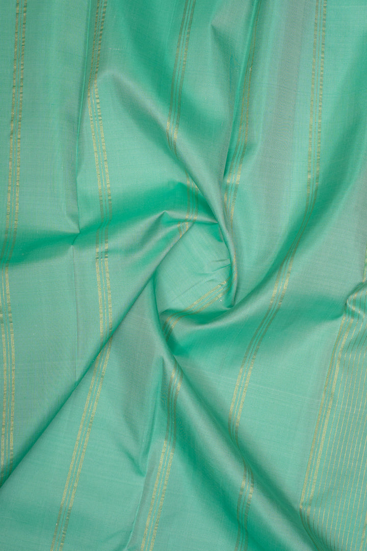 Off white and green handpainted pure kanchipuram silk saree