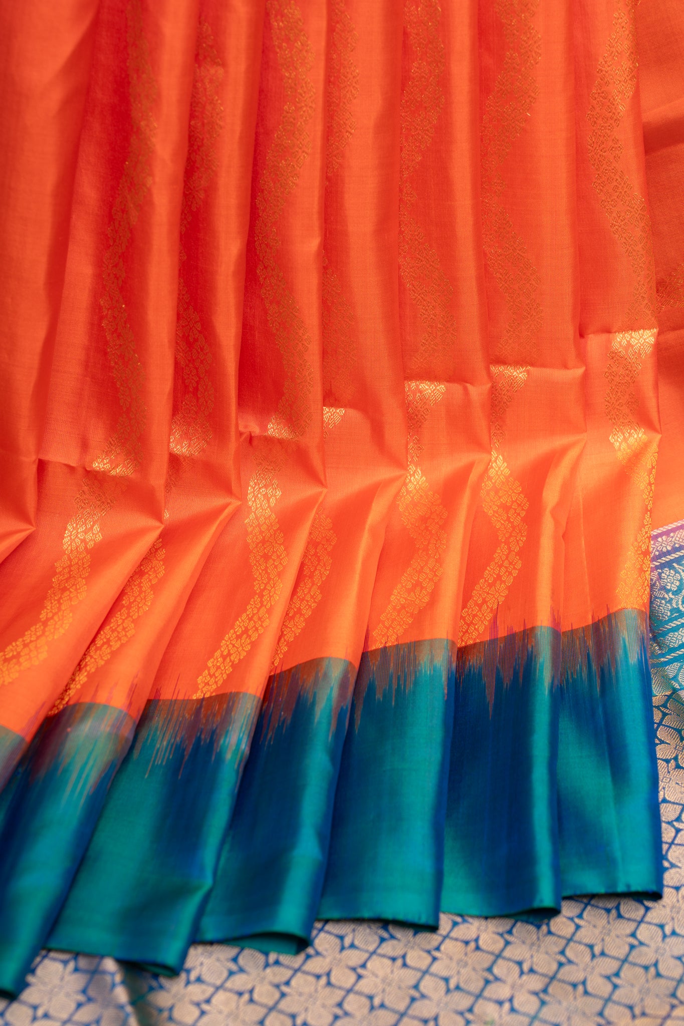 Orange and peacock blue Serpentine stripes pure soft silk saree