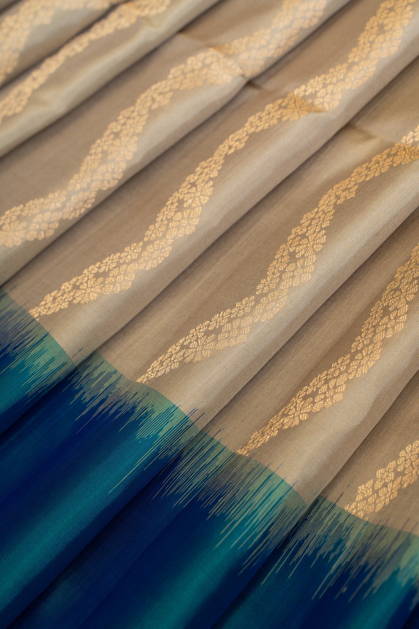 Beige and peacock blue serpentine stripes pure soft silk saree