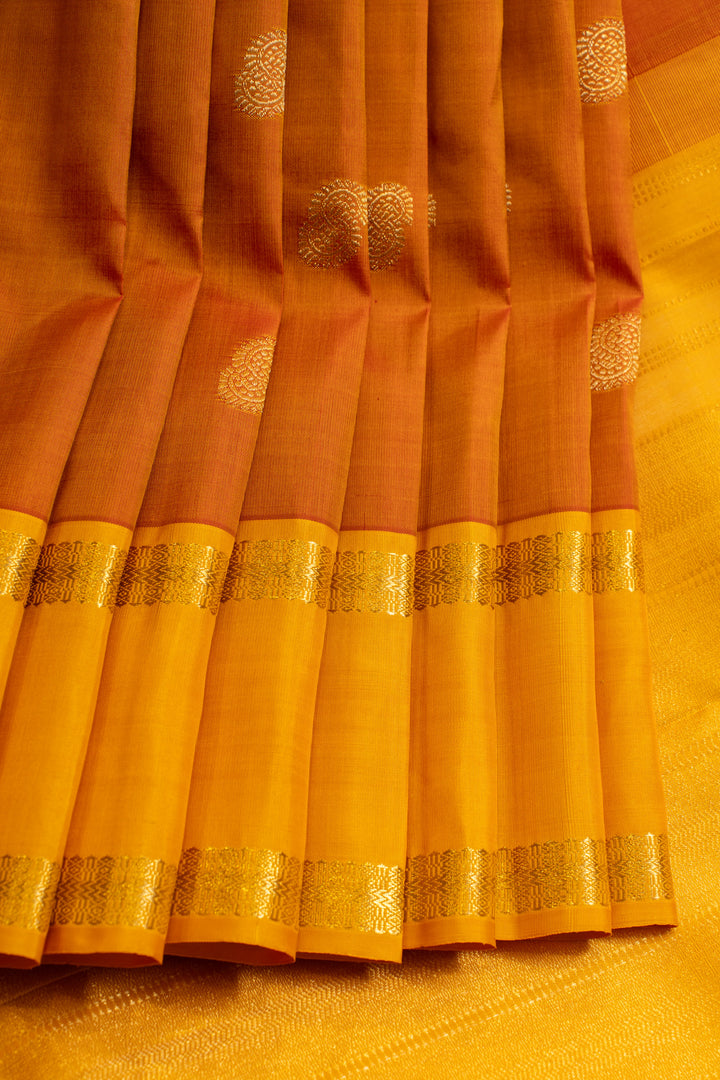 Rust orange and yellow rettai pettu pure Kanchipuram silk saree