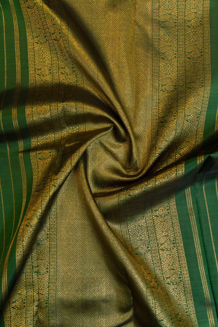 Pastel pink and bottle green traditional pure Kanchipuram silk saree