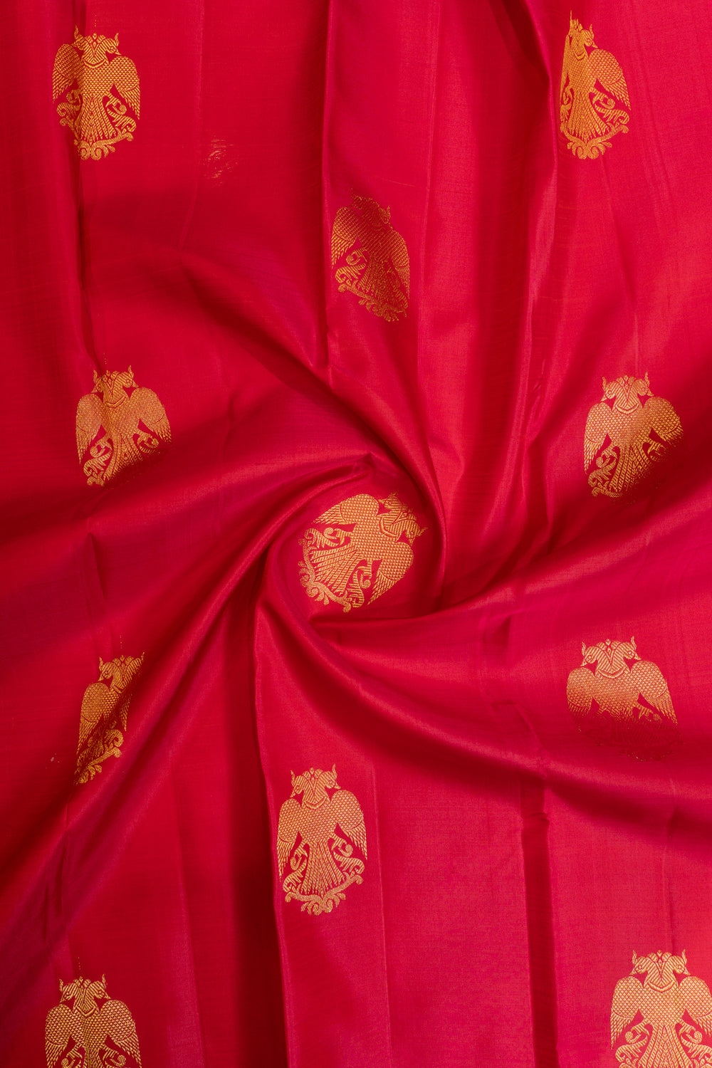Reddish pink iruthalaipakshi small border pure Kanchipuram silk saree