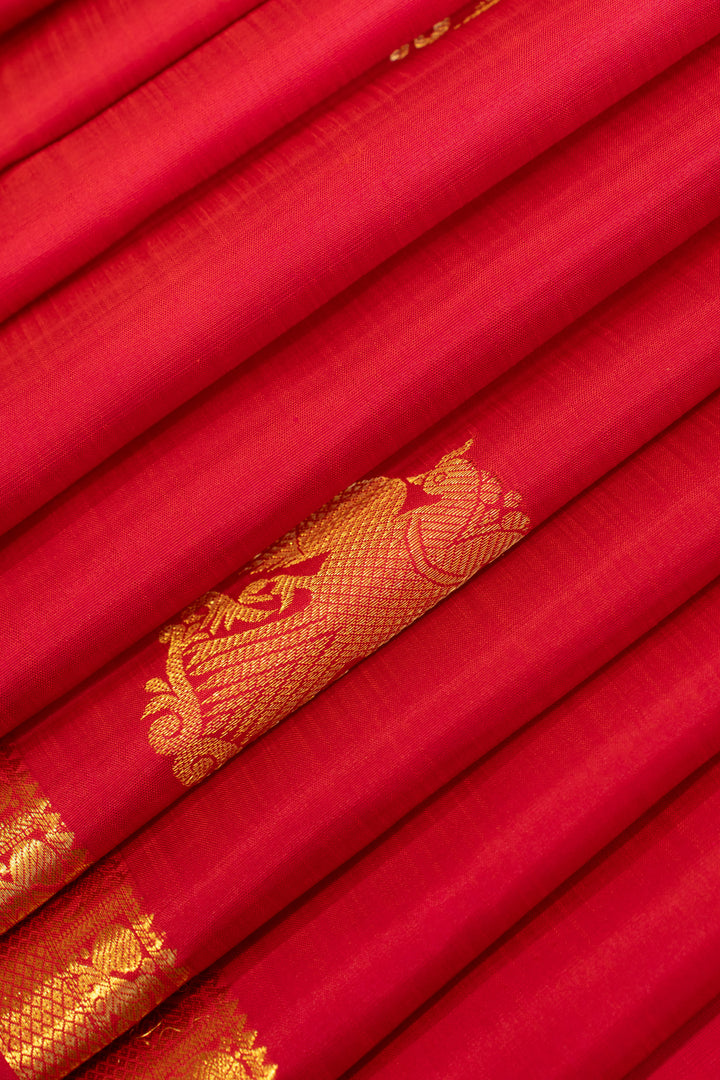 Reddish pink iruthalaipakshi small border pure Kanchipuram silk saree