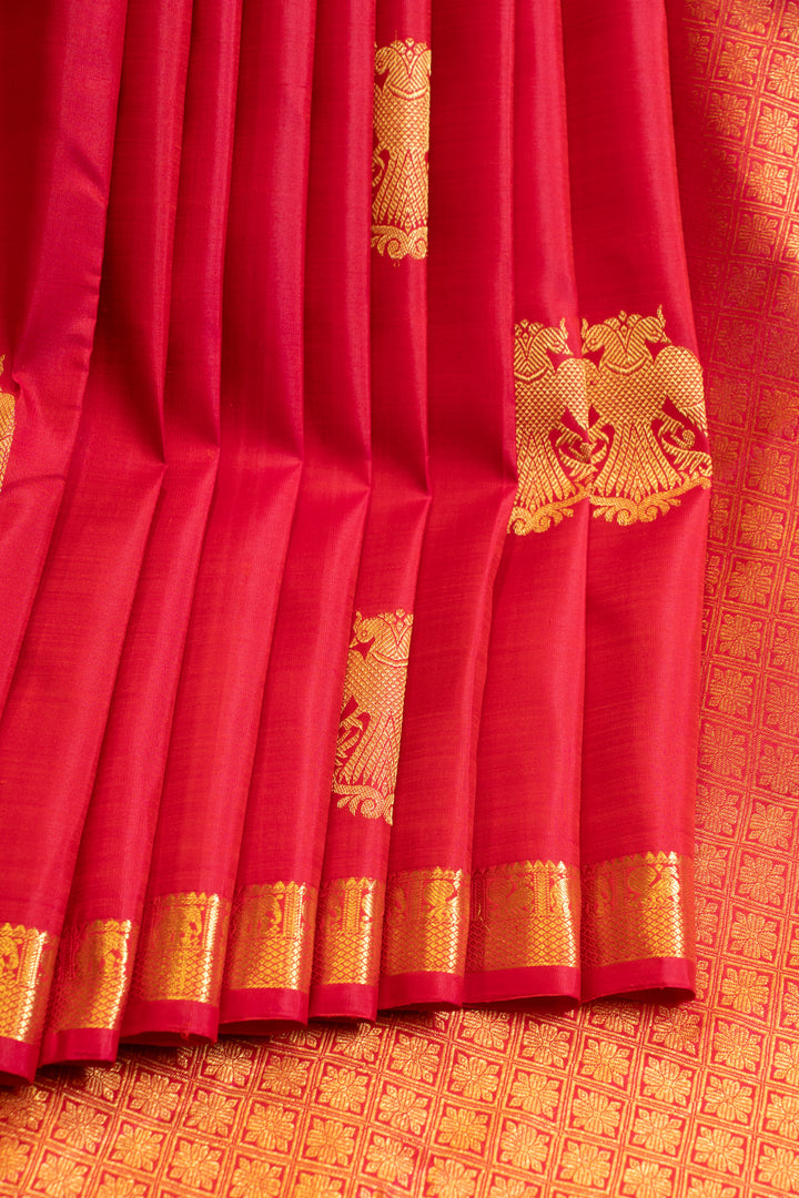 Reddish pink iruthalaipakshi small border pure Kanchipuram silk saree