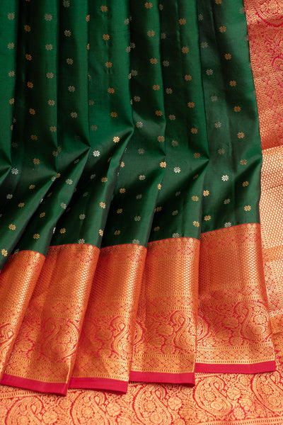 Full View of Woman in Bottle Green and Magenta Brocade Kanjivaram Silk Saree