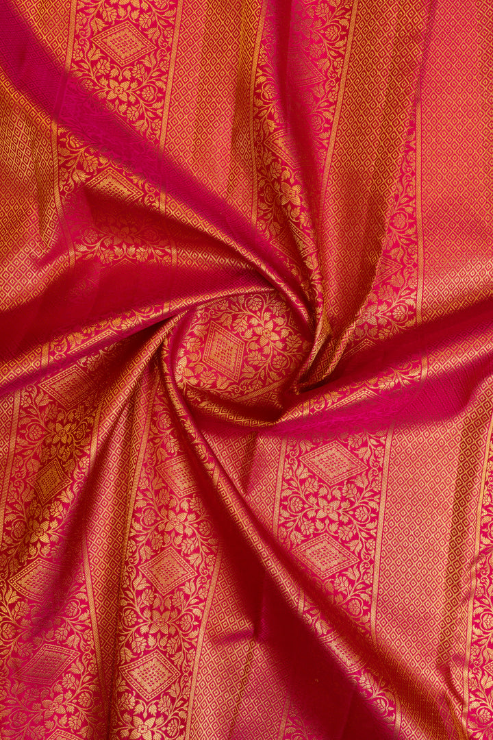 Traditional Kanchipuram silk saree in magenta with intricate Minakari work
