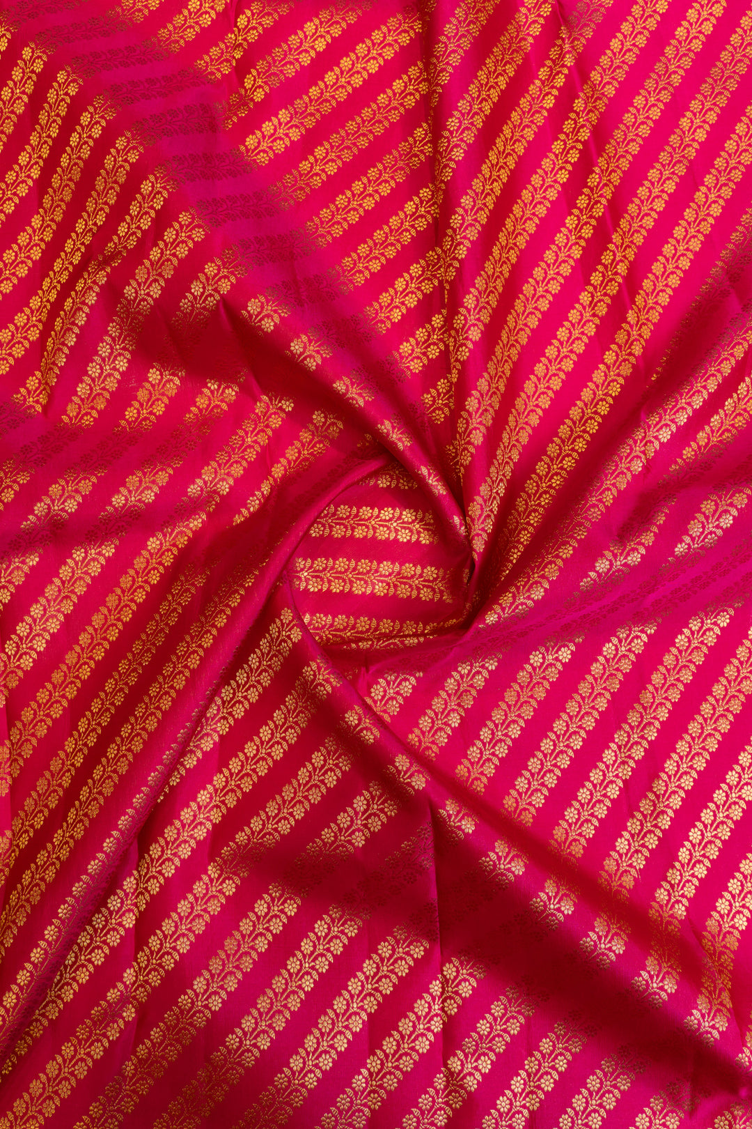 Elegant magenta Minakari silk saree draped for festive wear