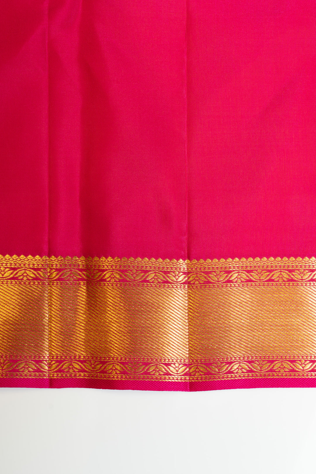 Handwoven Kanchipuram saree with magenta base and Minakari brocade border