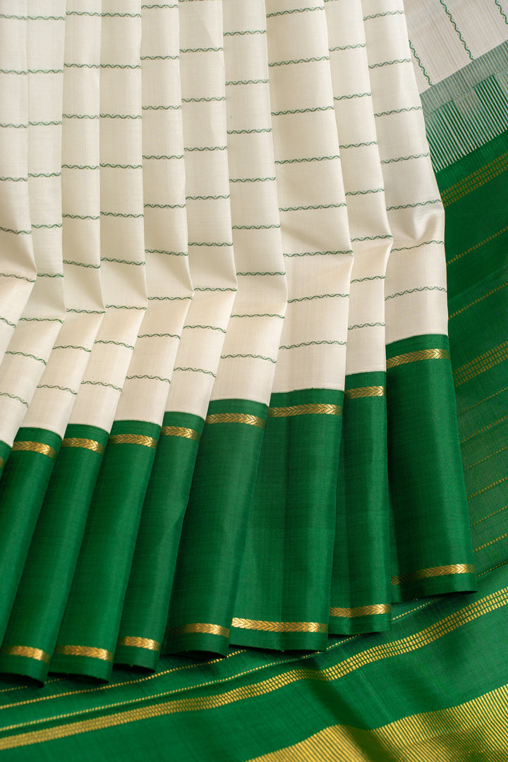 Off white and green neli stripes pure zari Kanchipuram silk saree