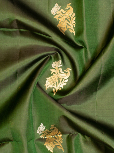 Indulge in luxury and refinement with our exquisite Bottle Green and Peach Soft Silk Saree. 