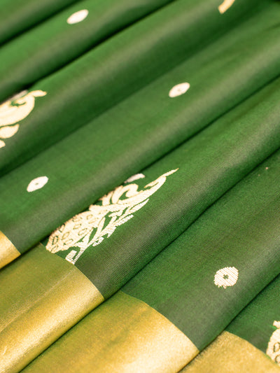 Indulge in luxury and refinement with our exquisite Bottle Green and Peach Soft Silk Saree. 