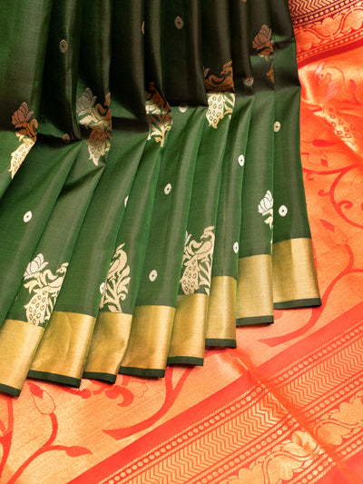 Indulge in luxury and refinement with our exquisite Bottle Green and Peach Soft Silk Saree. 