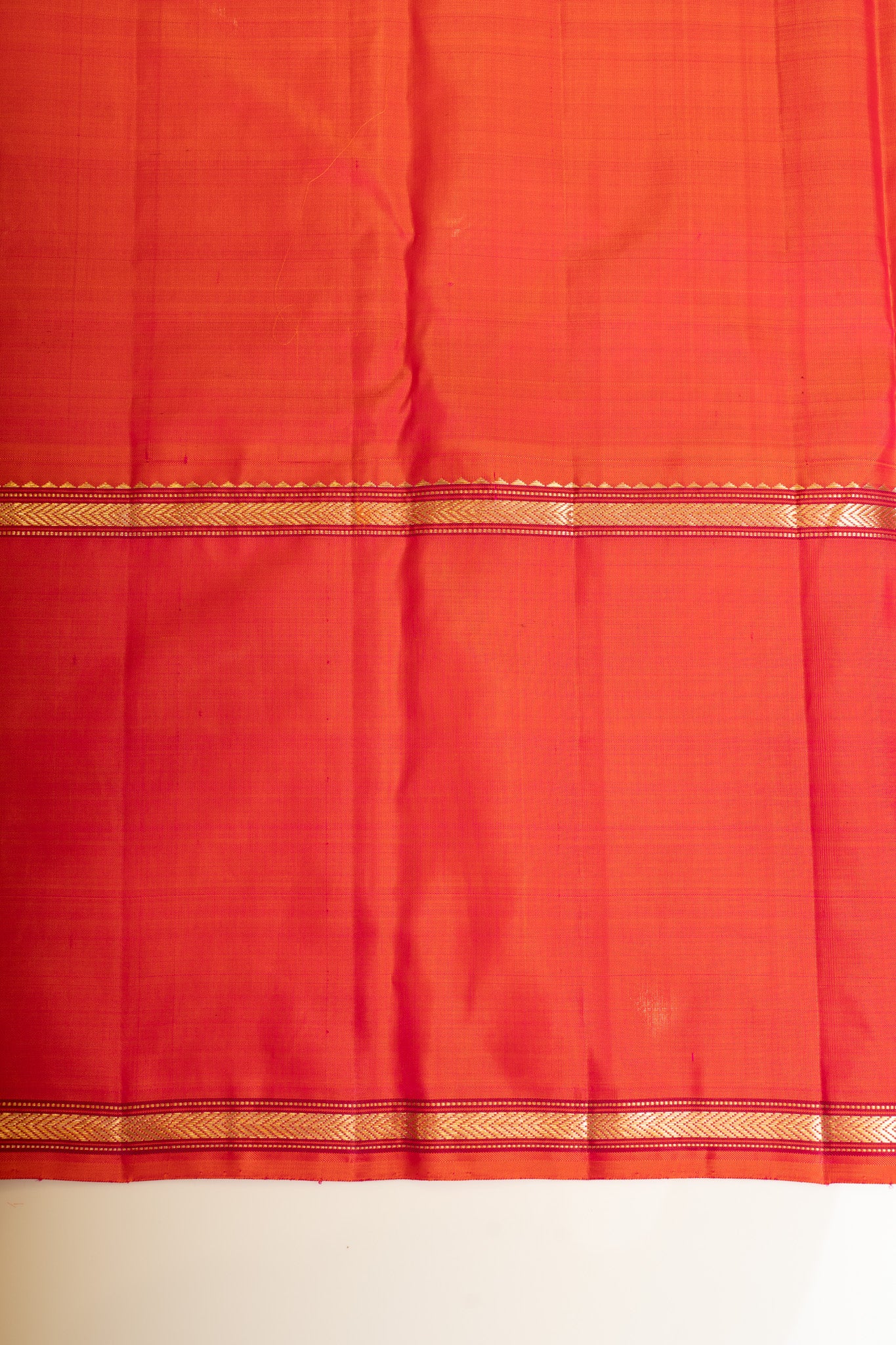 Elegant blouse paired with a black and peach Kanchipuram silk saree, complementing the traditional look