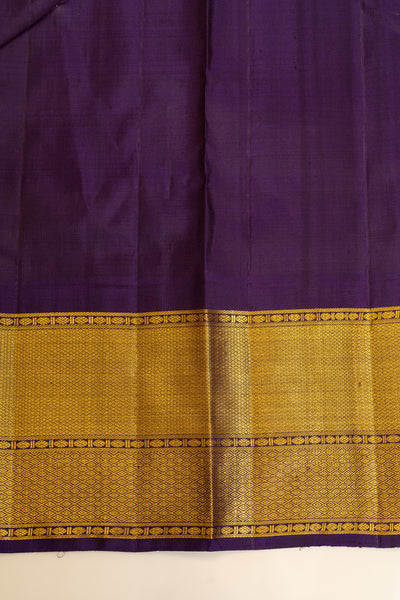 Detailed view of the blouse paired with a crimson red Kanjivaram saree, highlighting complementary embroidery and design