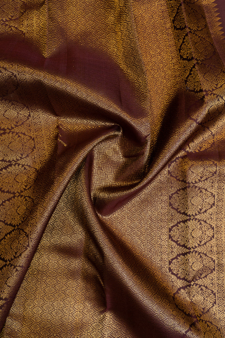 Maybe purple and rust pure Kanchipuram silk saree