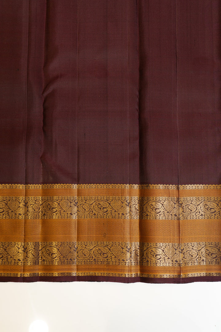 Maybe purple and rust pure Kanchipuram silk saree