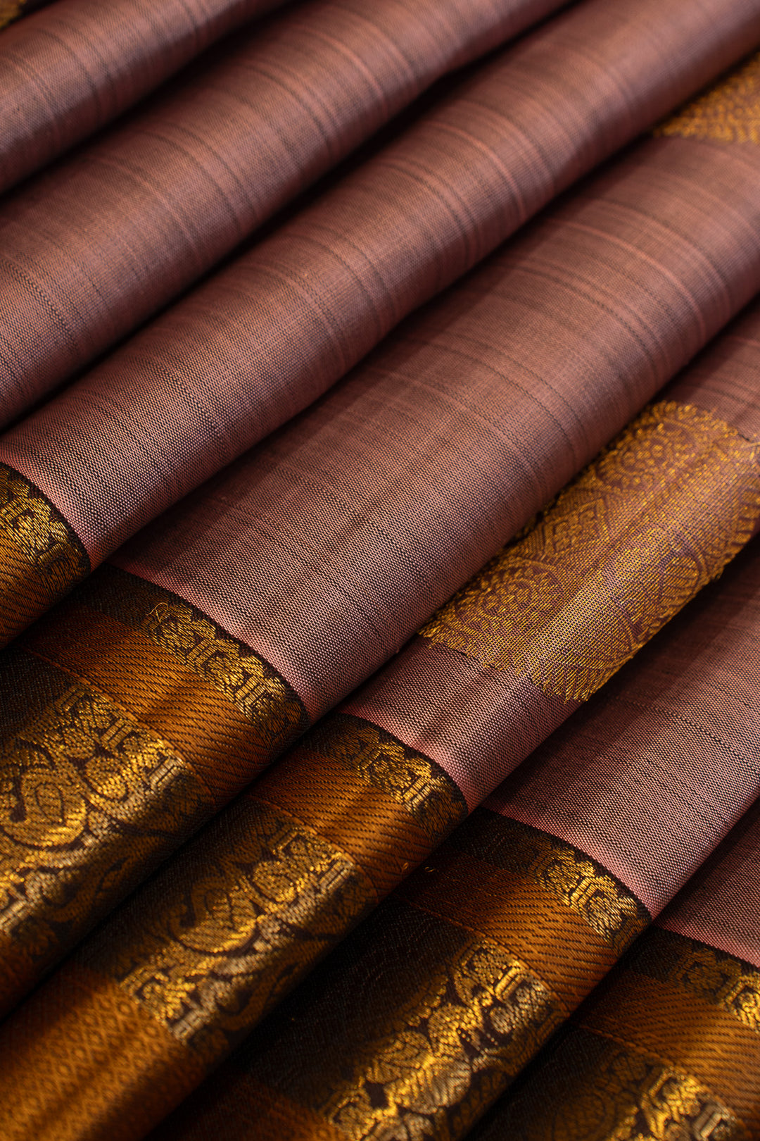 Maybe purple and rust pure Kanchipuram silk saree