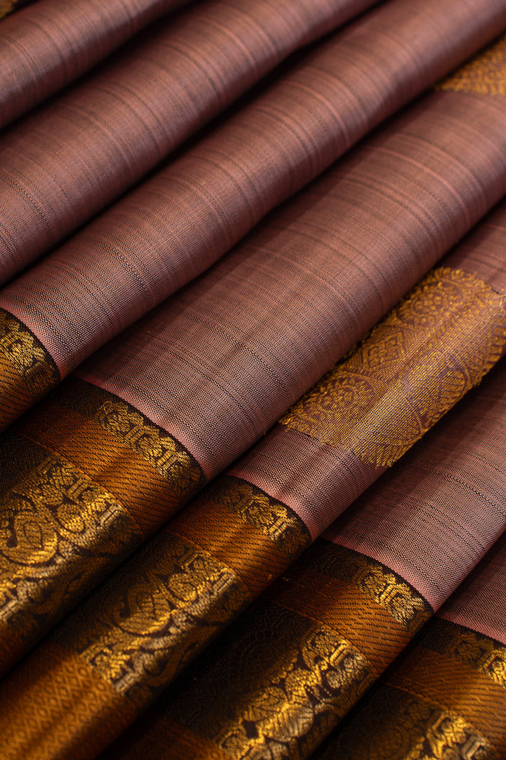 Maybe purple and rust pure Kanchipuram silk saree