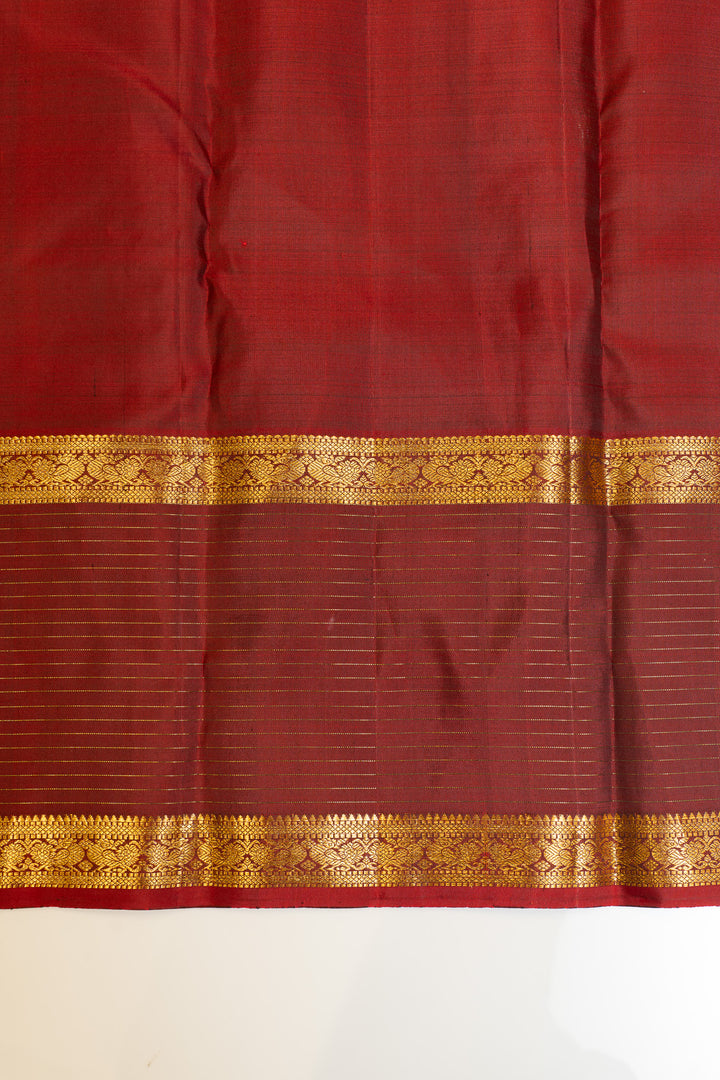 Maybe purple and rust pure Kanchipuram silk saree