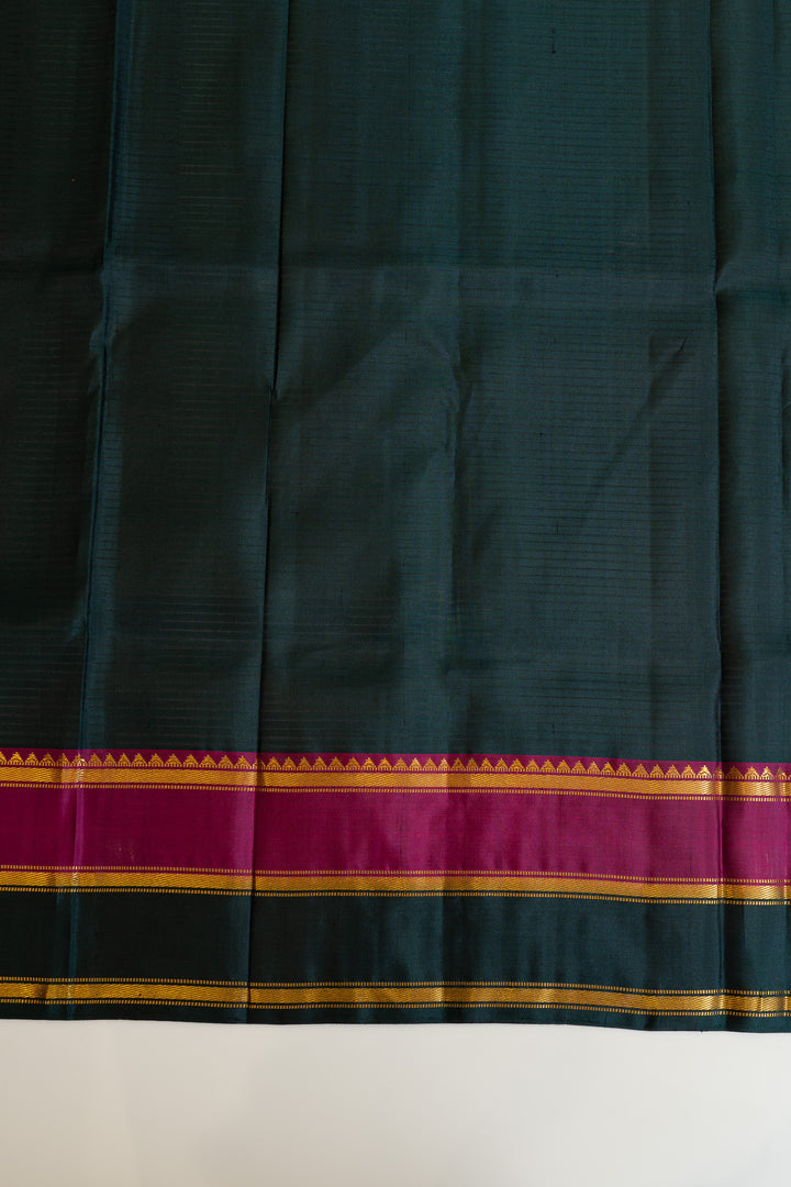 Dark green fabric with a colorful border on a white background