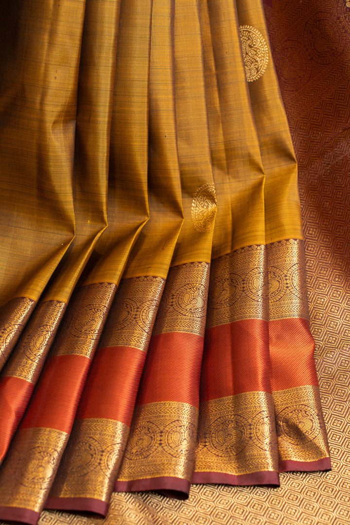 Mustard gold and orange pure Kanchipuram silk saree