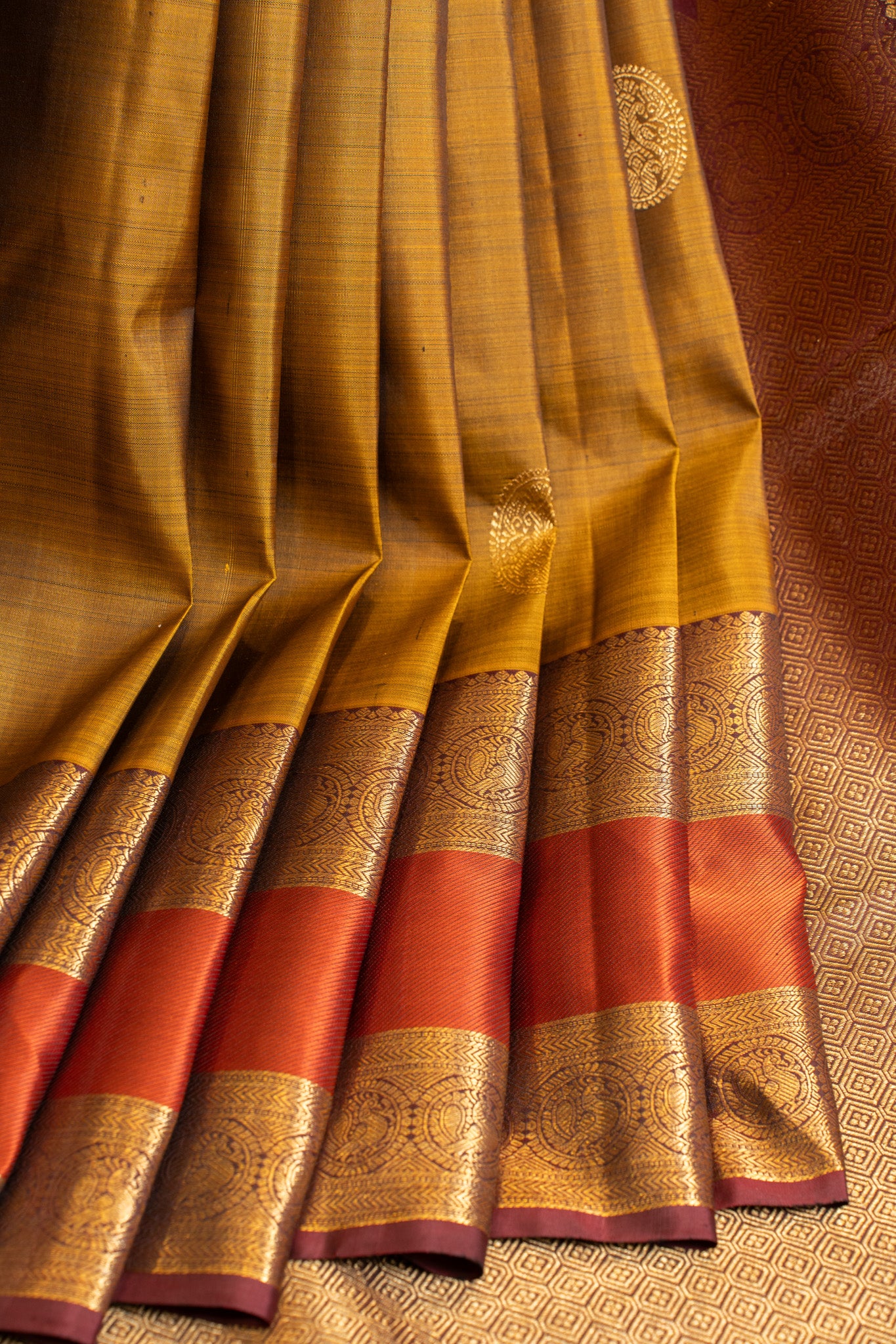 Mustard gold and orange pure Kanchipuram silk saree