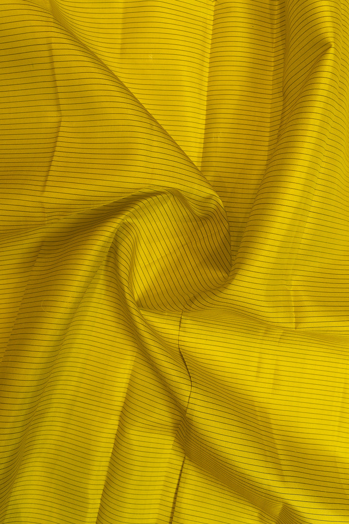 Close-up of yellow fabric with a ribbed texture