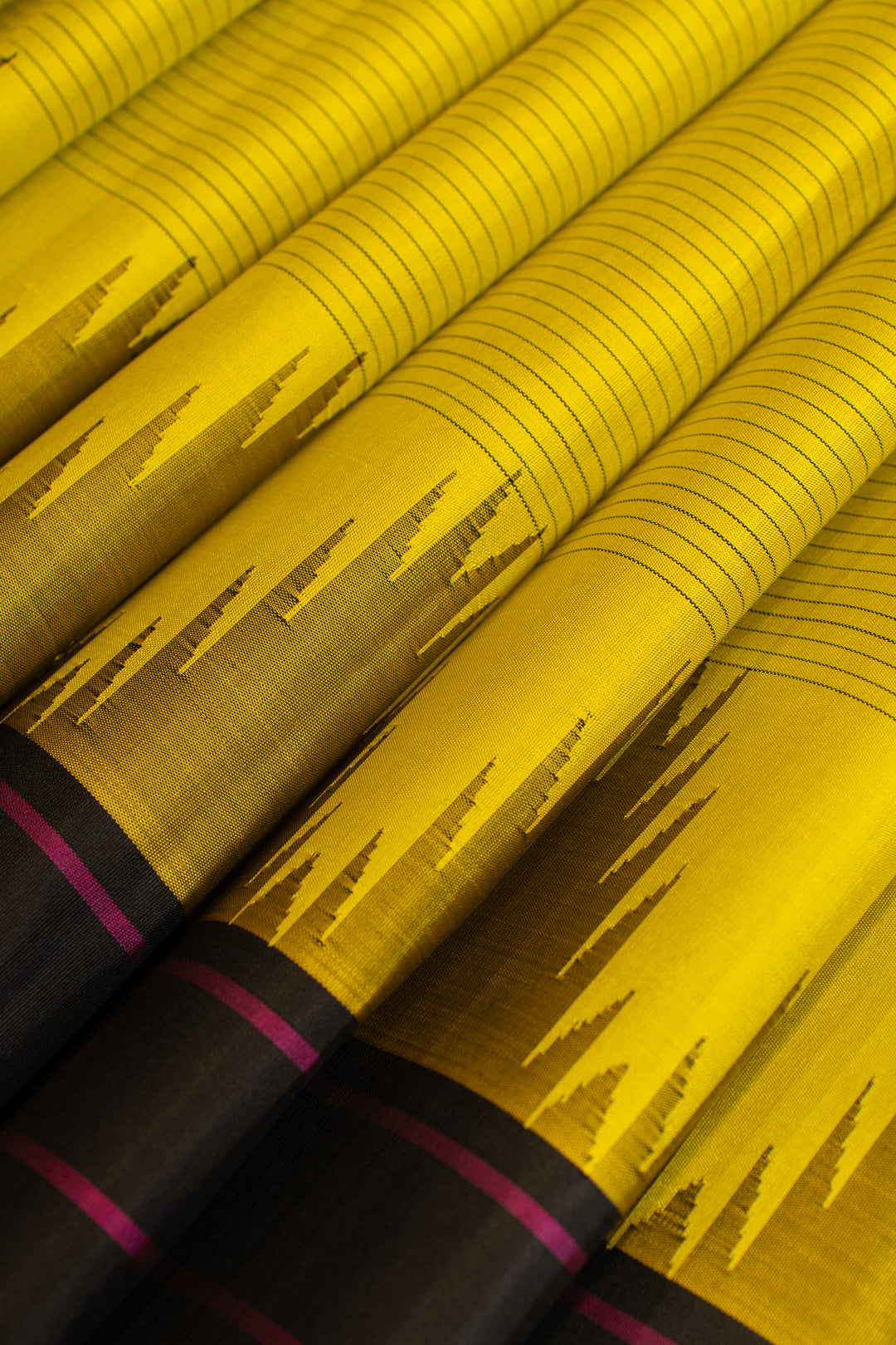 Yellow fabric with black and pink border