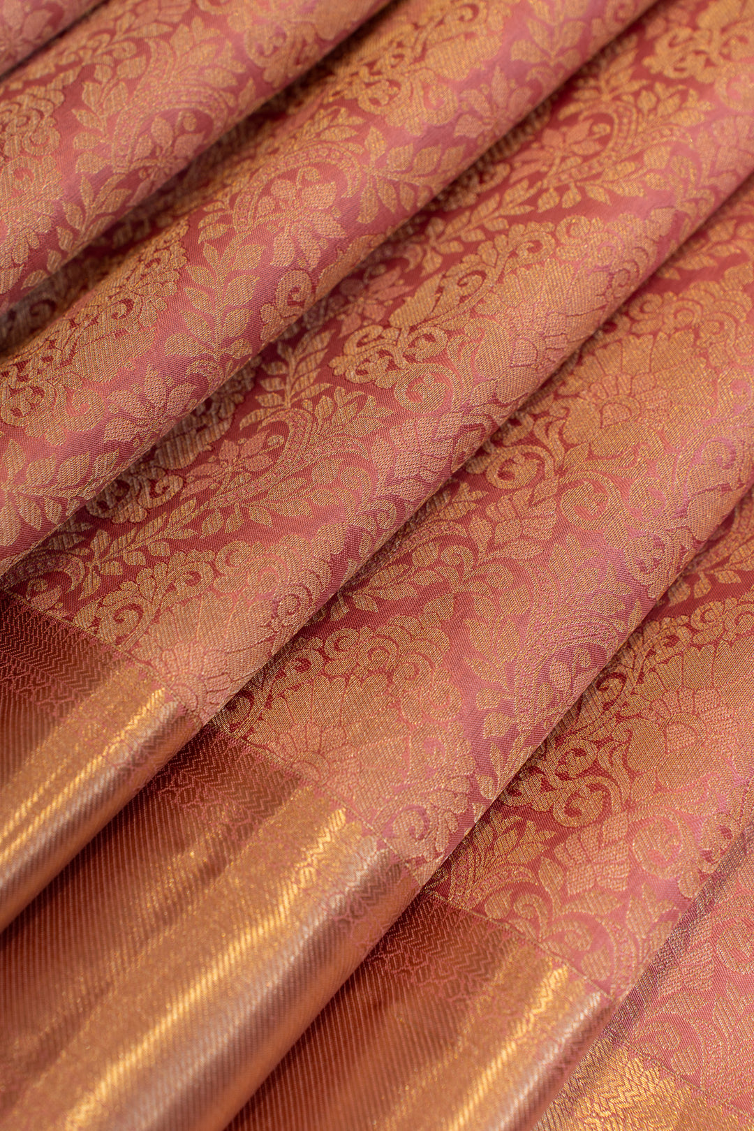 Close-up of pink and gold patterned fabric