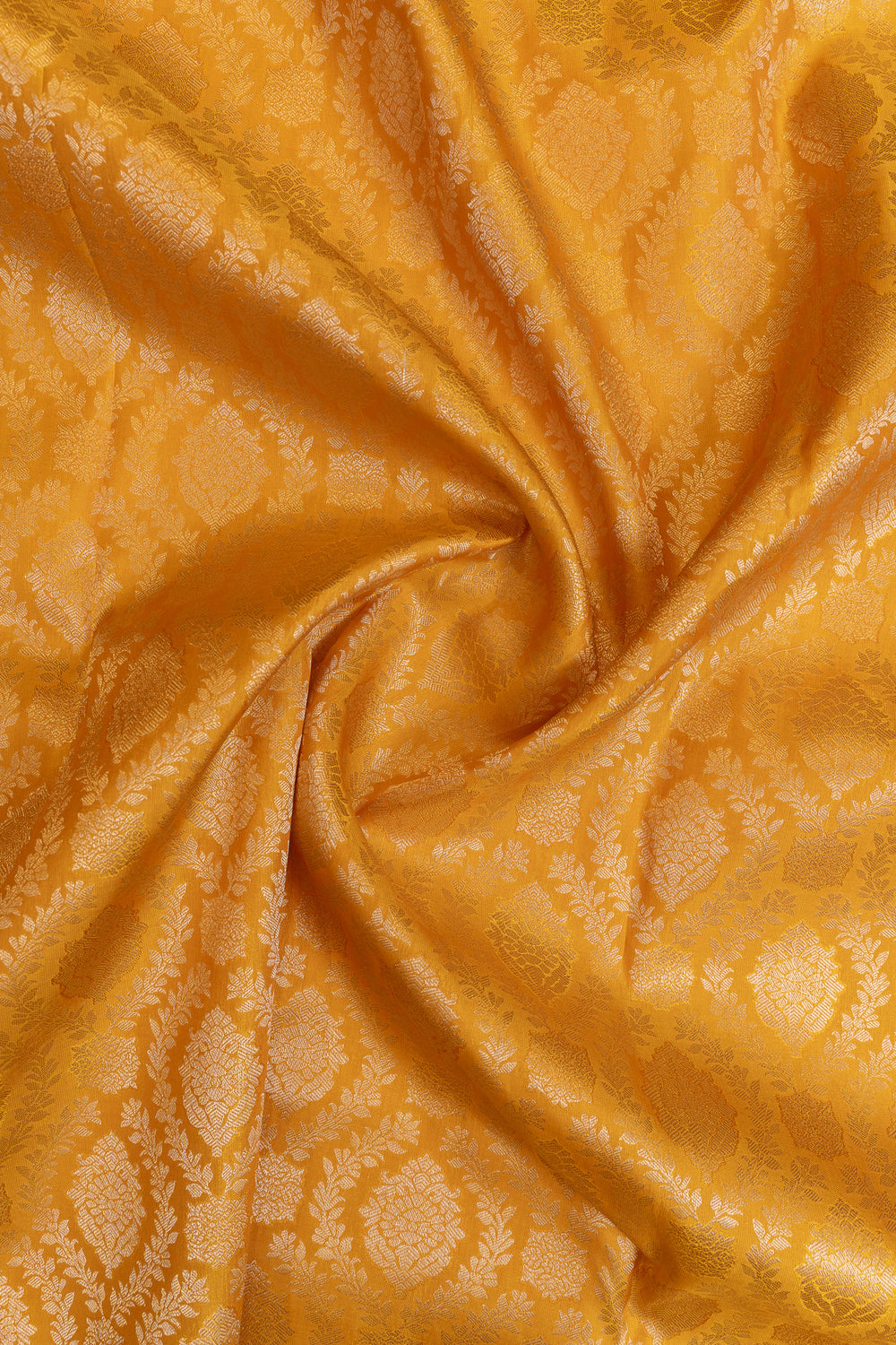 Close-up of gold fabric with a subtle pattern