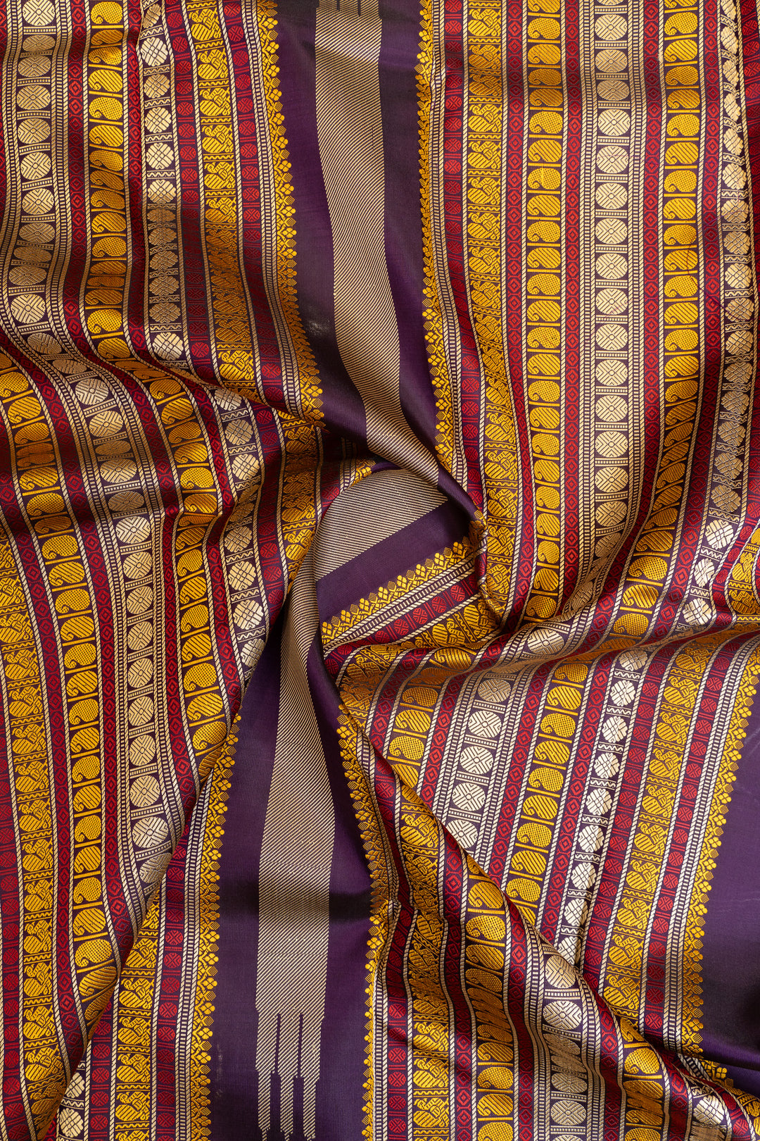 Striped fabric with gold, purple, and beige colors