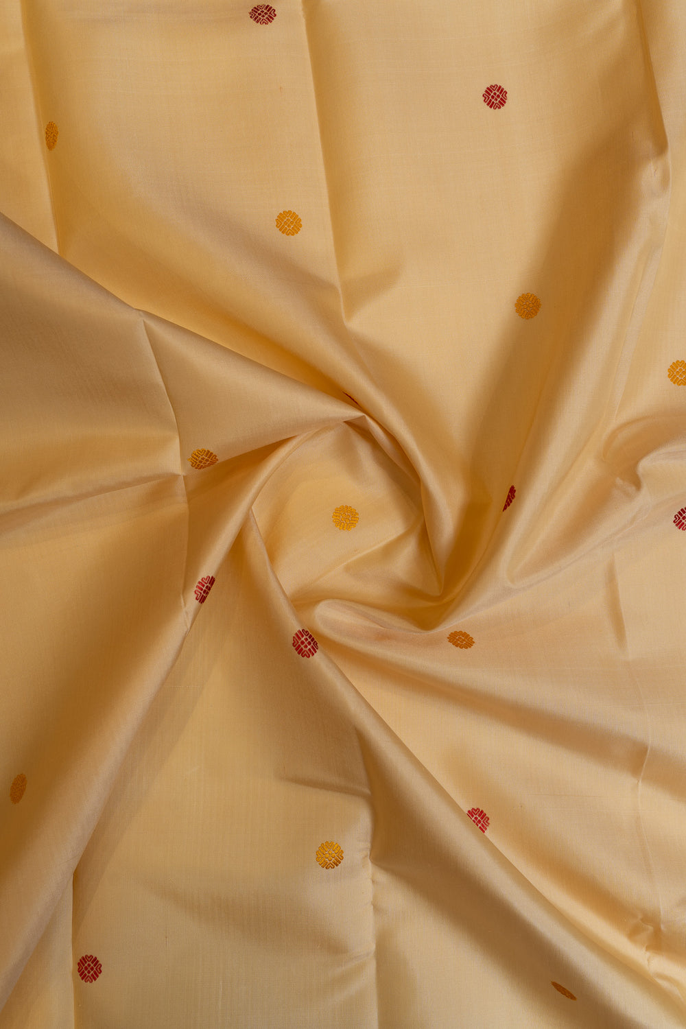 Beige fabric with small red and gold dots