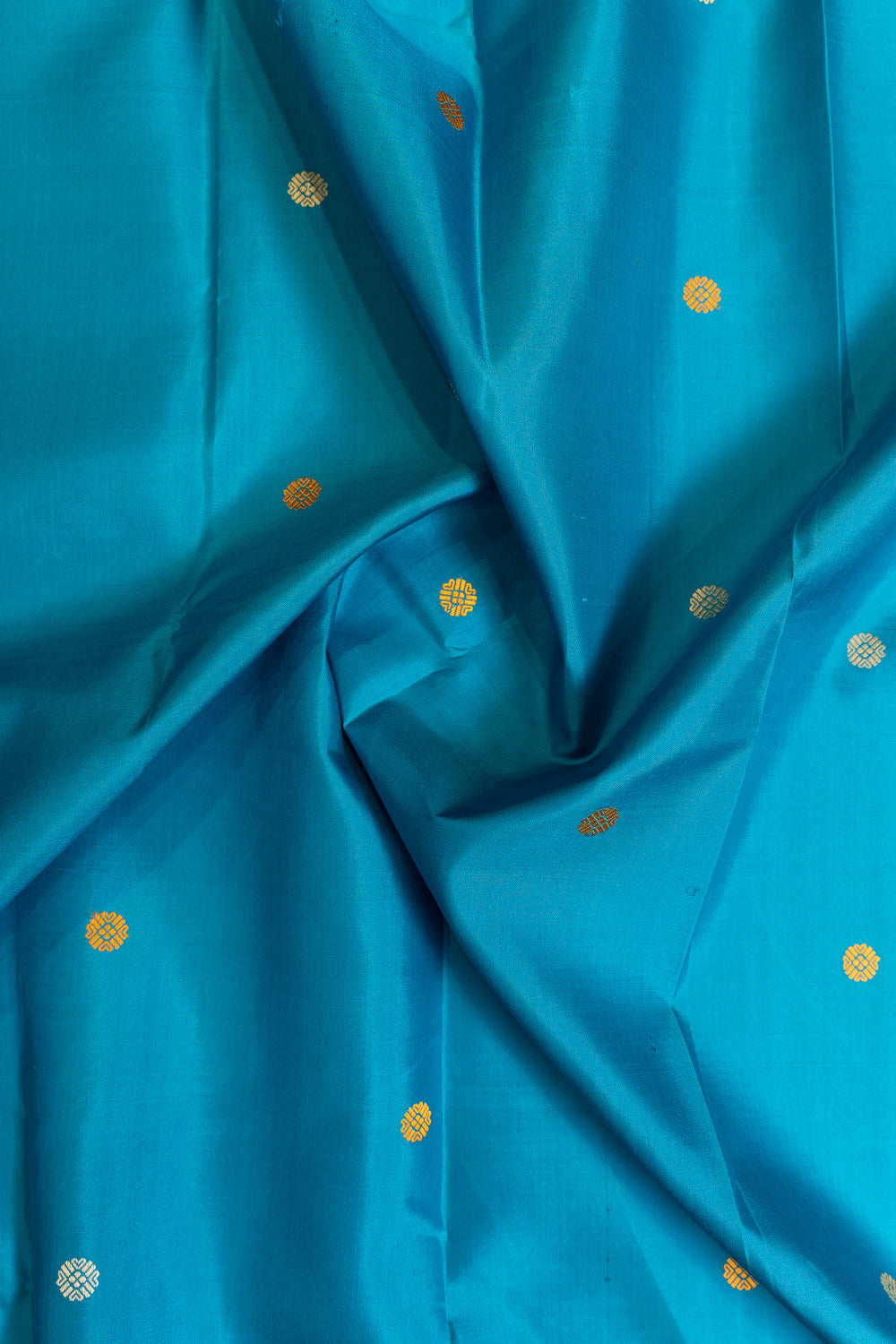 Blue fabric with gold polka dots