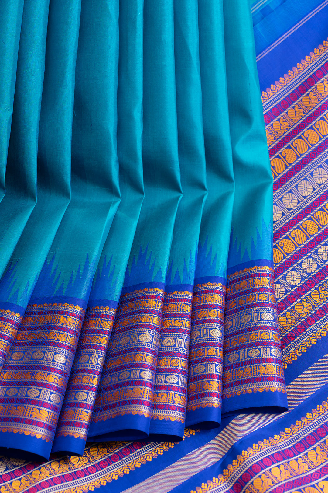 Turquoise saree with blue and yellow border