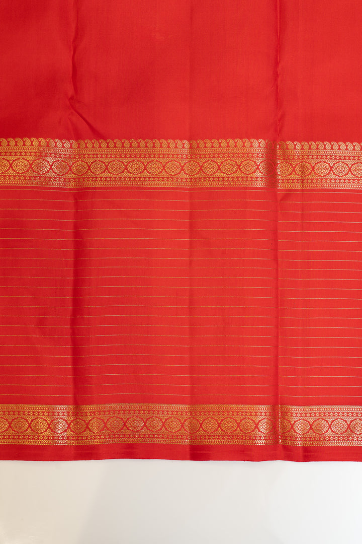 Red fabric with gold border on a white background